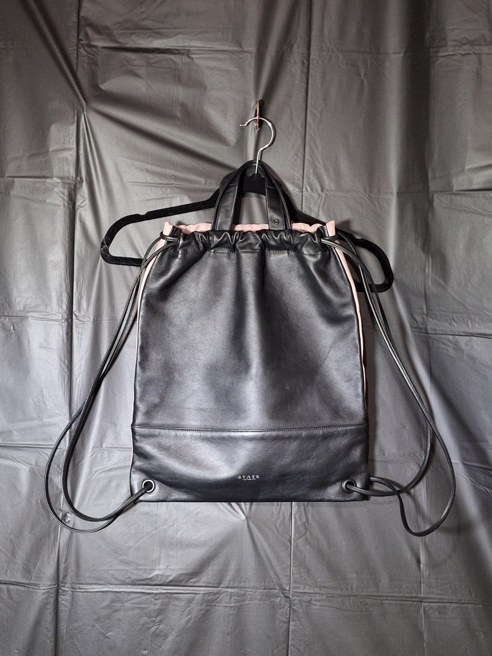 STATE Black & Pink Leather Drawstring Backpack.